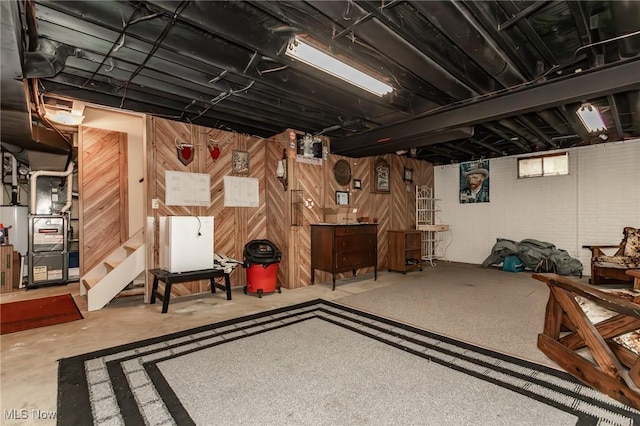 751 Bacon Rd, Oh, OH 44077 - unfinished basement with heating unit and wooden walls