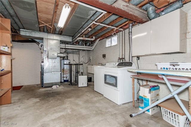 751 Bacon Rd, Oh, OH 44077 - basement featuring gas water heater and separate washer and dryer