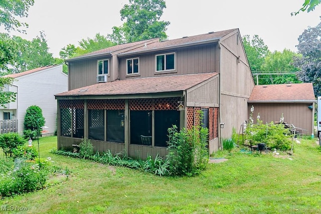 751 Bacon Rd, Oh, OH 44077 - back of house featuring roof with shingles, a sunroom, and a lawn