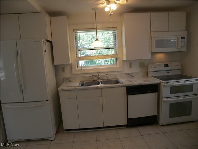 24 E 220th St E, Euclid, OH 44123 - kitchen featuring white appliances, white cabinets, light tile patterned floors, and decorative light fixtures