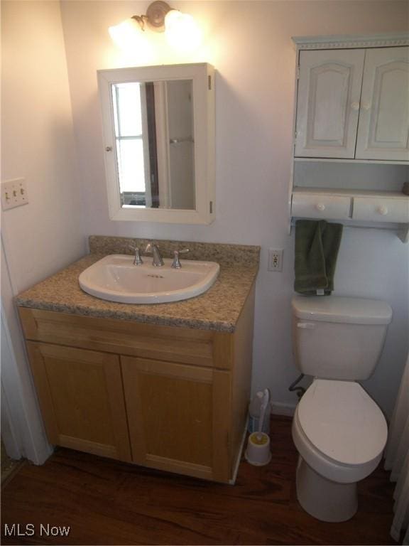 24 E 220th St E, Euclid, OH 44123 - half bath featuring vanity and wood finished floors