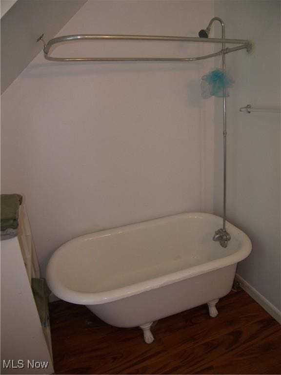 24 E 220th St E, Euclid, OH 44123 - full bathroom with wood finished floors and a freestanding bath