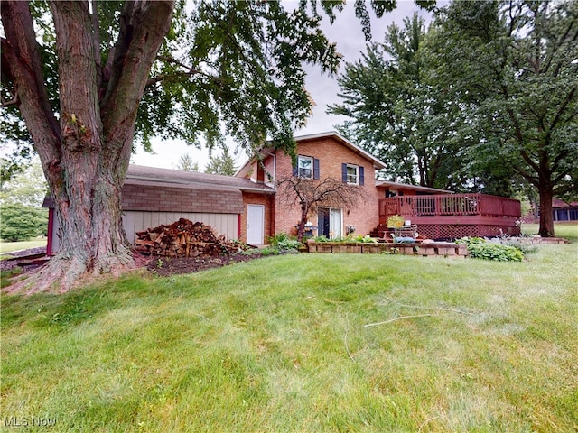 14003 Highview Dr, Dalton, OH 44618 - view of front of property with a wooden deck, a front yard, and brick siding