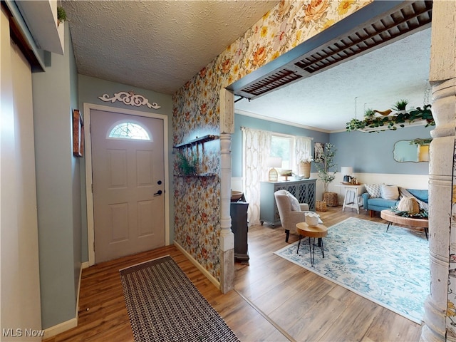 14003 Highview Dr, Dalton, OH 44618 - entrance foyer with plenty of natural light, a textured ceiling, wood finished floors, and wallpapered walls