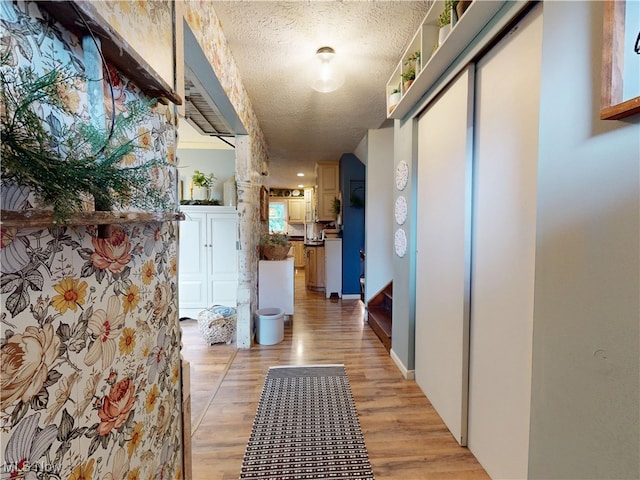 14003 Highview Dr, Dalton, OH 44618 - corridor featuring light wood finished floors and a textured ceiling