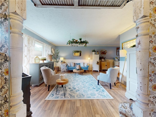 14003 Highview Dr, Dalton, OH 44618 - living area with ornate columns, ornamental molding, wood finished floors, and a textured ceiling