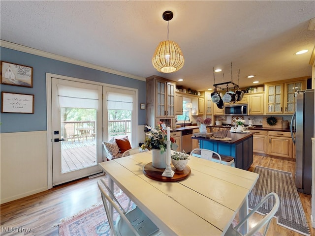 14003 Highview Dr, Dalton, OH 44618 - dining space with crown molding, light wood-style flooring, a chandelier, a textured ceiling, and wainscoting