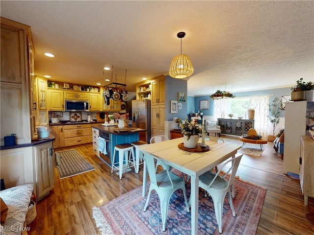 14003 Highview Dr, Dalton, OH 44618 - dining room with light wood-style floors, recessed lighting, and a textured ceiling