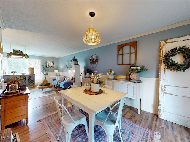 14003 Highview Dr, Dalton, OH 44618 - dining room with crown molding, light wood-type flooring, and a textured ceiling