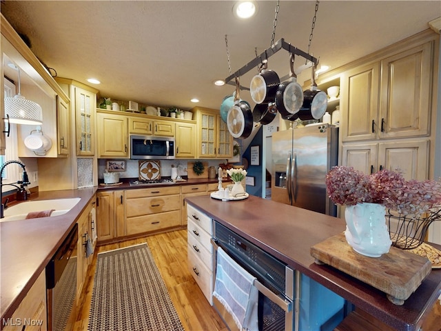 14003 Highview Dr, Dalton, OH 44618 - kitchen featuring stainless steel appliances, recessed lighting, light wood-style floors, glass insert cabinets, and dark countertops