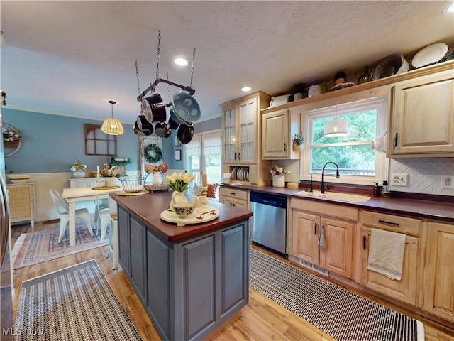14003 Highview Dr, Dalton, OH 44618 - kitchen featuring dishwasher, a kitchen island, backsplash, light wood-style flooring, and a textured ceiling