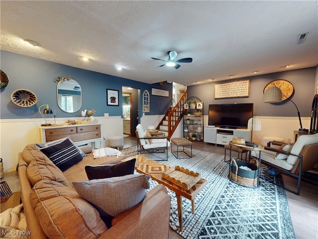 14003 Highview Dr, Dalton, OH 44618 - living area featuring stairway, a ceiling fan, wood finished floors, a textured ceiling, and recessed lighting