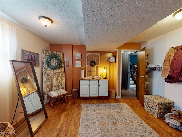 14003 Highview Dr, Dalton, OH 44618 - sitting room featuring wood finished floors, stairs, and a textured ceiling