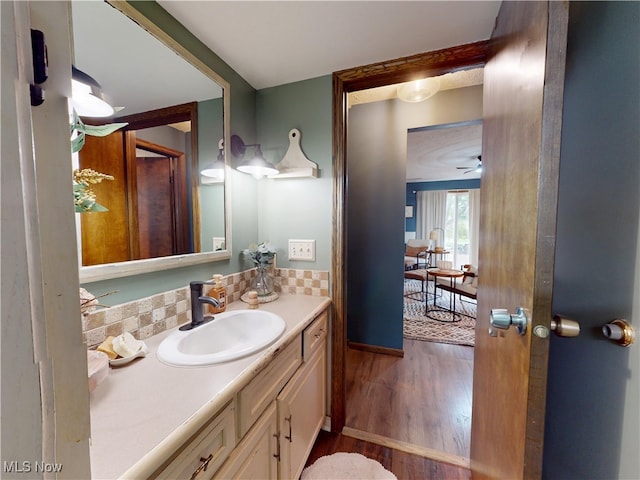 14003 Highview Dr, Dalton, OH 44618 - bathroom with wood finished floors, vanity, a ceiling fan, and tasteful backsplash