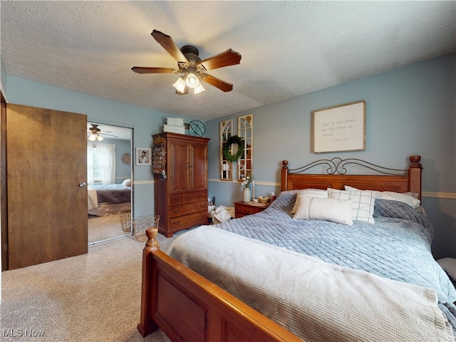 14003 Highview Dr, Dalton, OH 44618 - bedroom with a closet, light carpet, ceiling fan, and a textured ceiling