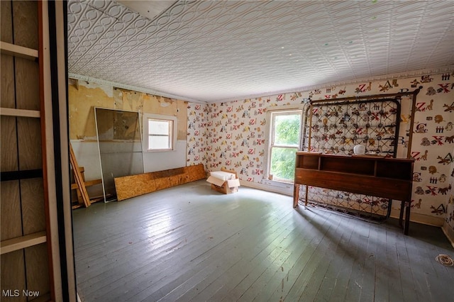 55225 Township Road 224, Fresno, OH 43824 - unfurnished bedroom featuring wallpapered walls, hardwood / wood-style flooring, and a closet