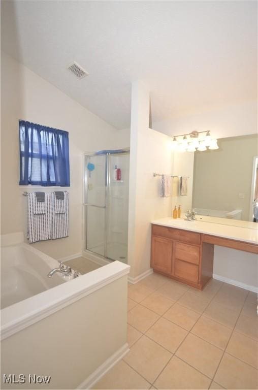 4909 Garnet Cir, Stow, OH 44224 - full bath with tile patterned flooring, a garden tub, vanity, a stall shower, and vaulted ceiling