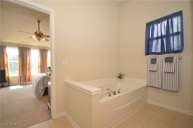 4909 Garnet Cir, Stow, OH 44224 - ensuite bathroom featuring tile patterned floors, a bath, and ceiling fan