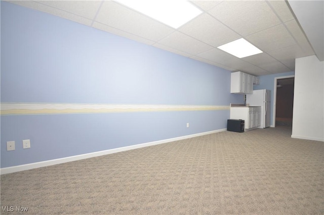4909 Garnet Cir, Stow, OH 44224 - below grade area featuring freestanding refrigerator, a paneled ceiling, and light colored carpet