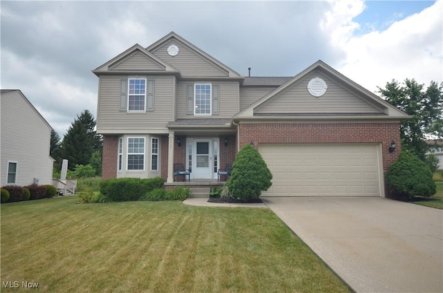 4909 Garnet Cir, Stow, OH 44224 - traditional-style home with brick siding, driveway, a front lawn, and a garage