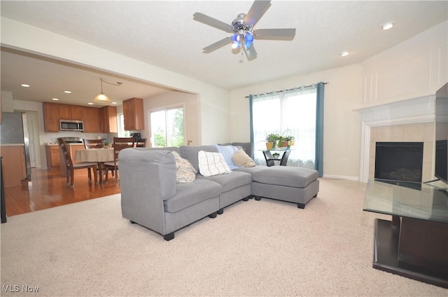 4909 Garnet Cir, Stow, OH 44224 - living area featuring a ceiling fan, a fireplace, light colored carpet, and recessed lighting