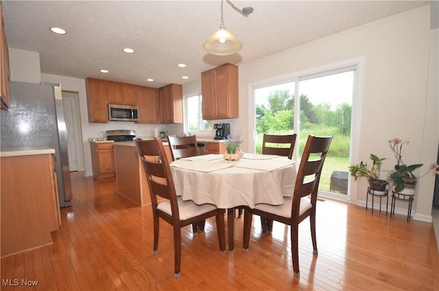4909 Garnet Cir, Stow, OH 44224 - dining area with light wood-type flooring and recessed lighting
