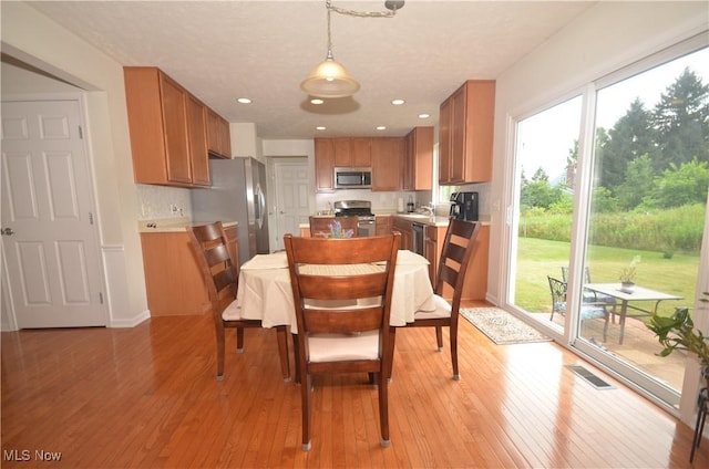 4909 Garnet Cir, Stow, OH 44224 - dining area with light wood-style flooring and recessed lighting