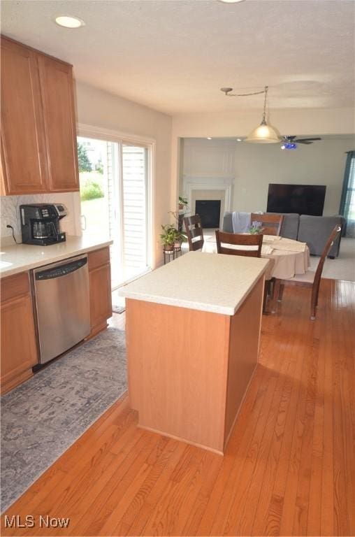 4909 Garnet Cir, Stow, OH 44224 - kitchen featuring stainless steel dishwasher, open floor plan, light wood-type flooring, light countertops, and recessed lighting