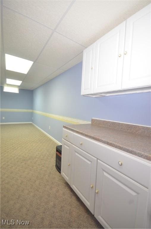 4909 Garnet Cir, Stow, OH 44224 - kitchen with white cabinets and carpet