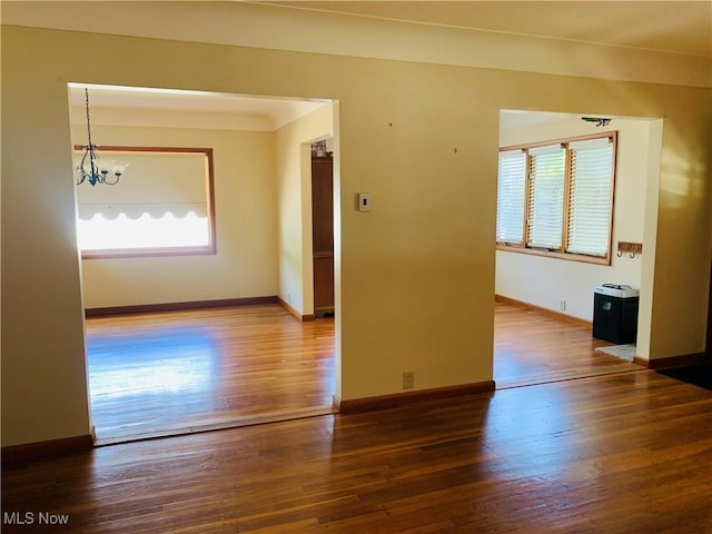 1528 Felton Rd, South Euclid, OH 44121 - empty room with wood finished floors and a chandelier