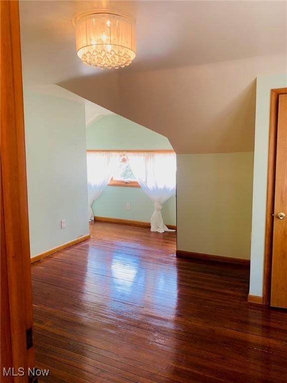 1528 Felton Rd, South Euclid, OH 44121 - additional living space featuring wood finished floors, lofted ceiling, and a chandelier