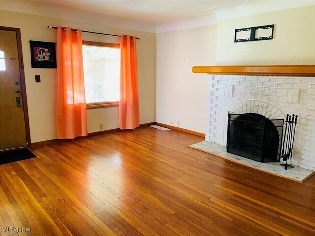 1528 Felton Rd, South Euclid, OH 44121 - unfurnished living room featuring wood-type flooring and a fireplace