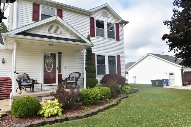 307 Crimson Cir, Campbell, OH 44405 - view of front of home featuring a porch and a front lawn