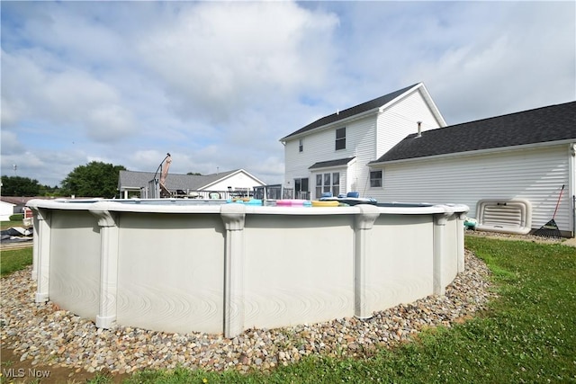 307 Crimson Cir, Campbell, OH 44405 - back of house featuring an outdoor pool