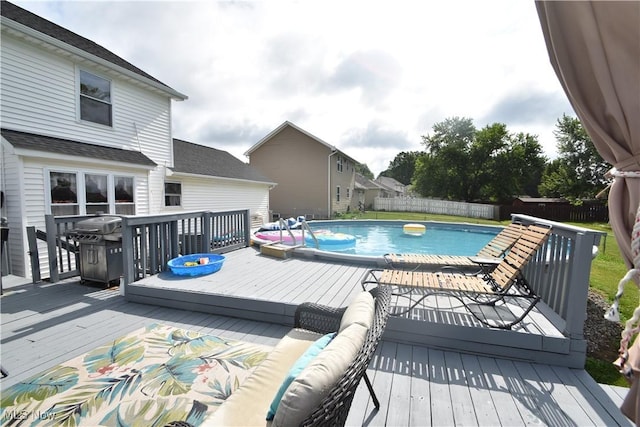 307 Crimson Cir, Campbell, OH 44405 - view of swimming pool featuring a fenced backyard, a wooden deck, and grilling area