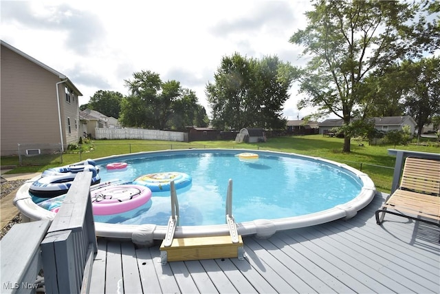 307 Crimson Cir, Campbell, OH 44405 - view of swimming pool featuring a deck and a fenced backyard