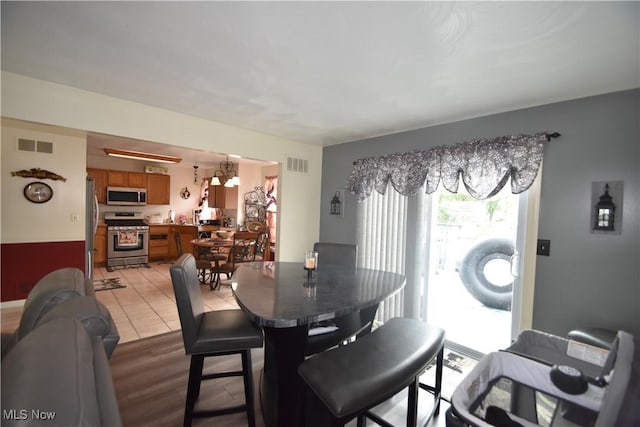 307 Crimson Cir, Campbell, OH 44405 - dining room featuring light wood-style floors