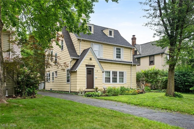 16205 Fernway Rd, Shaker Heights, OH 44120 - view of front of home featuring a front lawn and a chimney