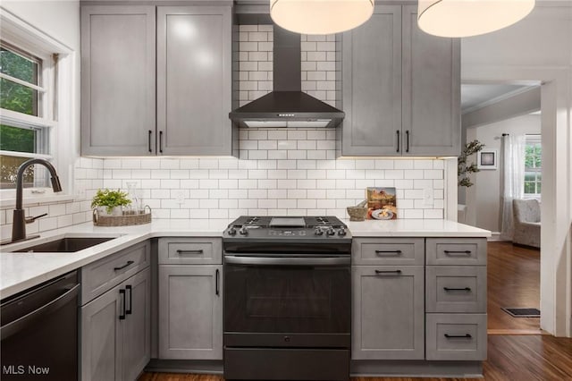16205 Fernway Rd, Shaker Heights, OH 44120 - kitchen featuring stainless steel range with gas stovetop, wall chimney exhaust hood, dishwasher, gray cabinets, and ornamental molding