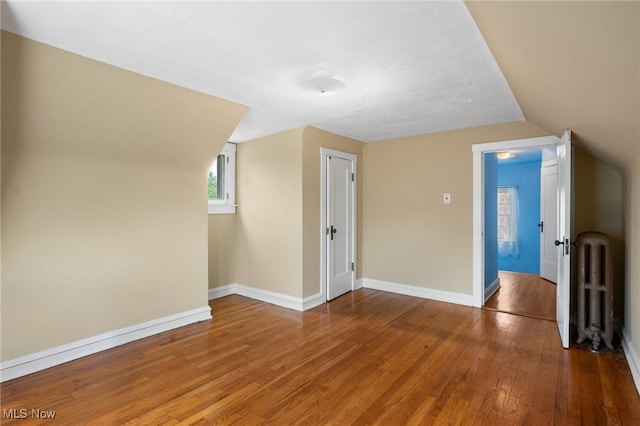 16205 Fernway Rd, Shaker Heights, OH 44120 - bonus room with radiator, wood finished floors, and lofted ceiling