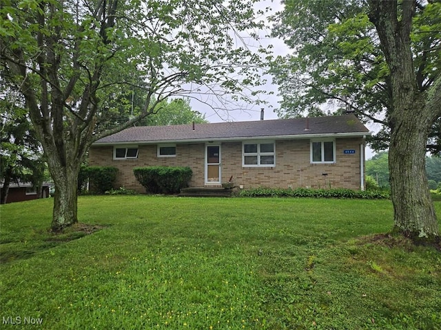 4544 Springvale Ave SW, Canton, OH 44706 - ranch-style house featuring a front lawn and brick siding
