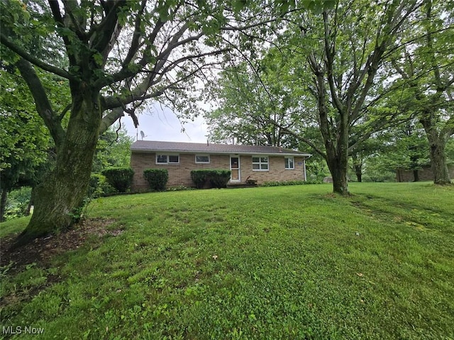 4544 Springvale Ave SW, Canton, OH 44706 - rear view of property featuring a lawn and brick siding
