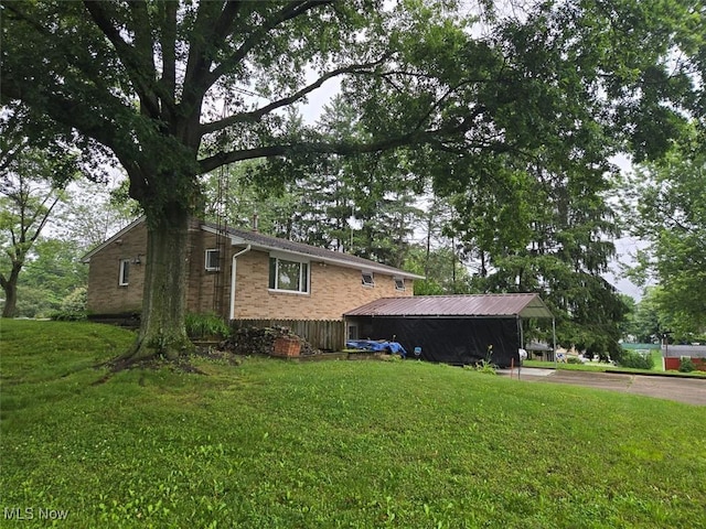 4544 Springvale Ave SW, Canton, OH 44706 - view of side of home with a yard and brick siding