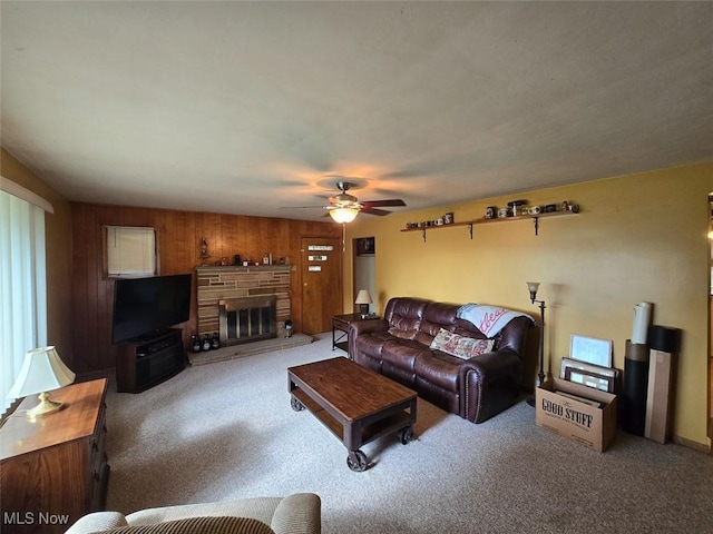 4544 Springvale Ave SW, Canton, OH 44706 - living area with a ceiling fan, carpet flooring, a fireplace, and wood walls