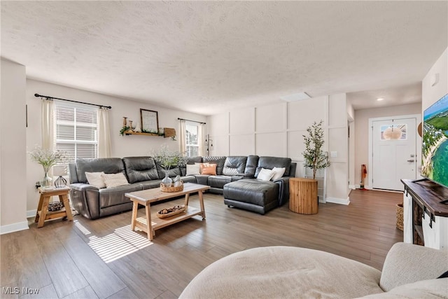3772 Willow Way, Perry, OH 44081 - living room featuring wood finished floors and a textured ceiling