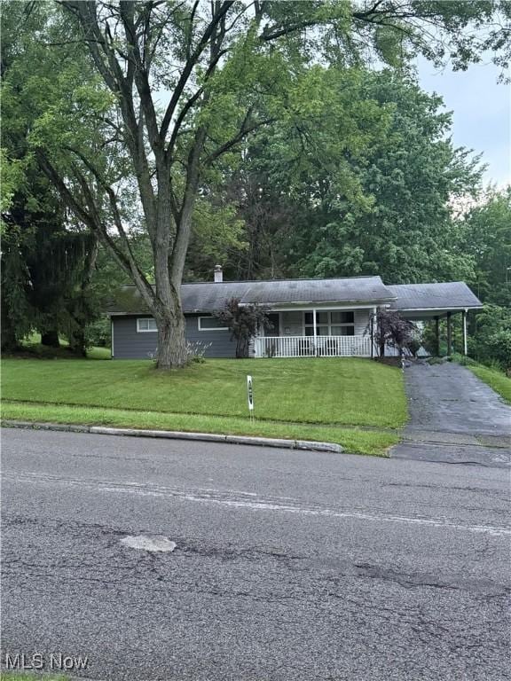 382 Rosemont Ave, Austintown, OH 44515 - single story home with asphalt driveway, an attached carport, a front lawn, and a porch