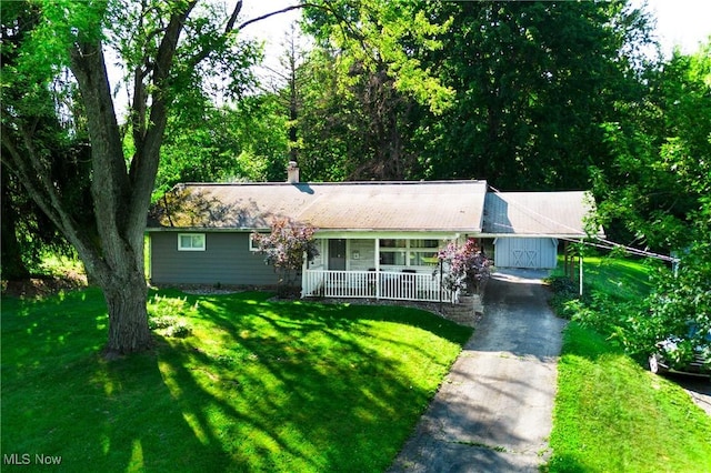 382 Rosemont Ave, Austintown, OH 44515 - single story home featuring covered porch, driveway, a front yard, and a chimney
