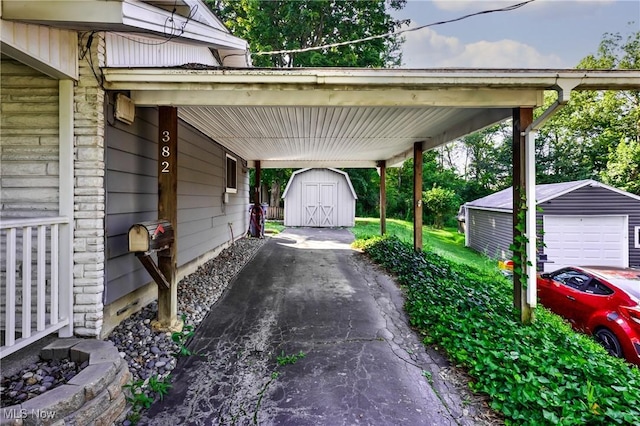 382 Rosemont Ave, Austintown, OH 44515 - view of car parking with driveway, a shed, a garage, and an attached carport