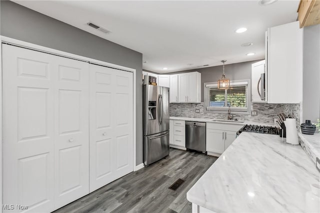 382 Rosemont Ave, Austintown, OH 44515 - kitchen with stainless steel appliances, backsplash, recessed lighting, white cabinetry, and dark wood-type flooring