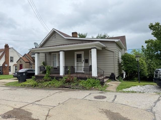120 Welday Ave, Steubenville, OH 43952 - view of front of house featuring covered porch and a chimney